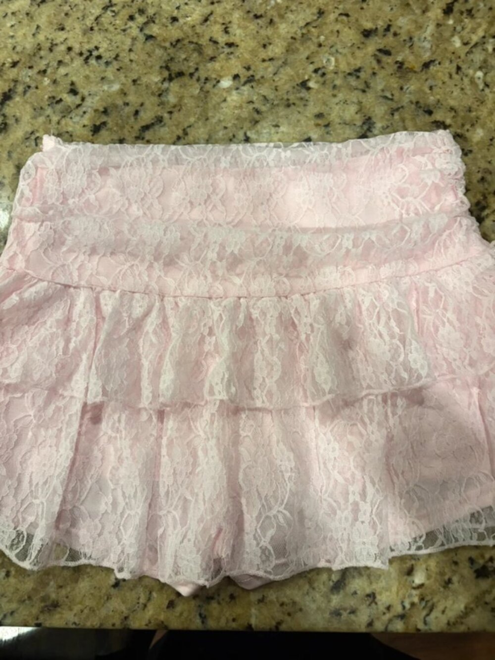Light pink lace dress with built in shorts. Size medium in women’s